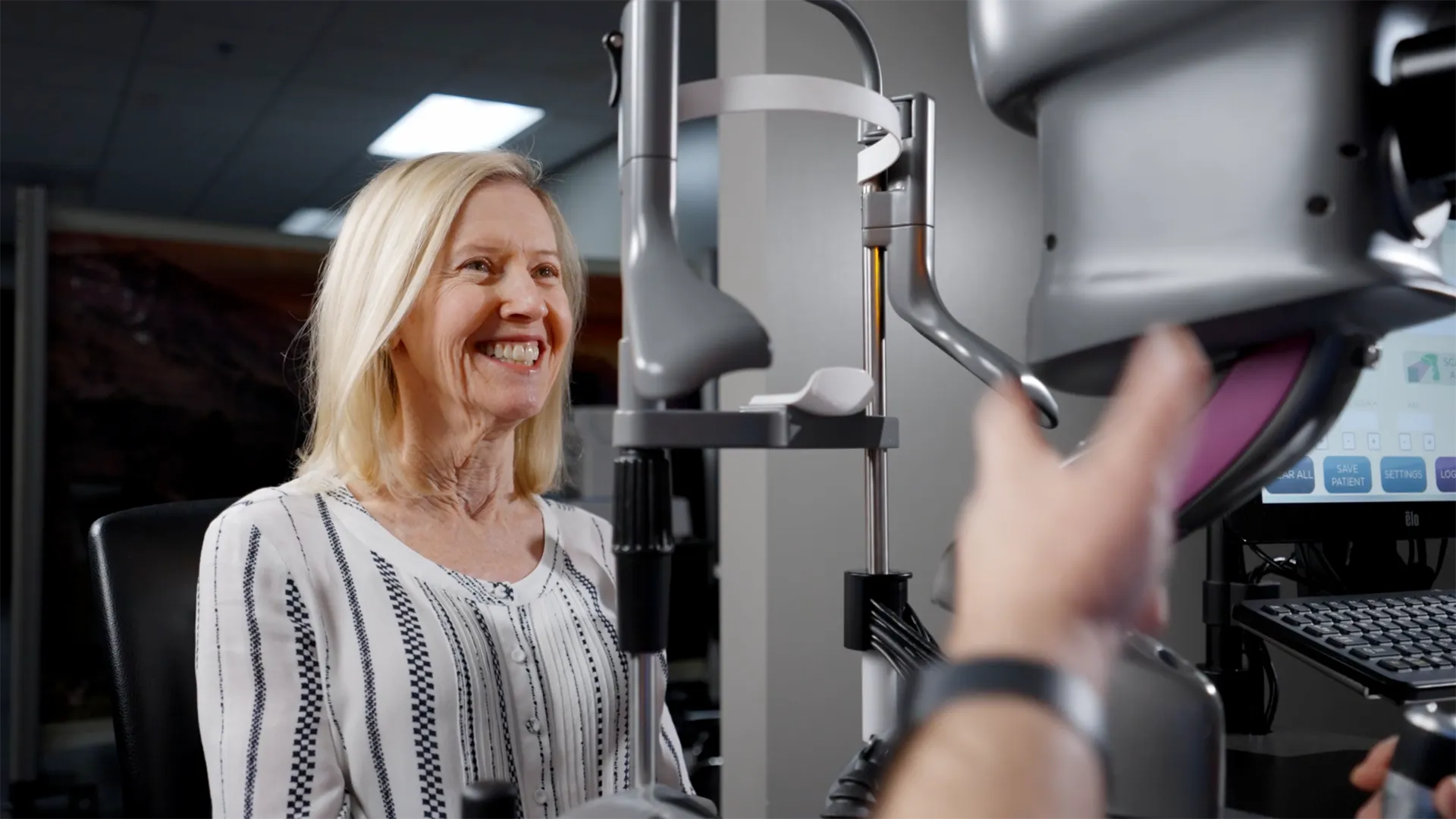 Bonnie smiling while receiving a light treatment from the LDD